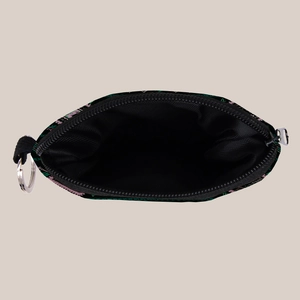 Detail shot of the aztec print coin purse showing internal black lining and zip closure