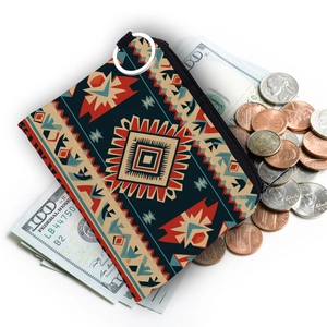 Detail shot of the Aztec print coin purse showing zipper closure with cash and coins