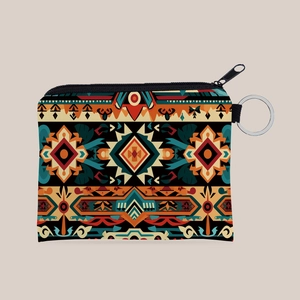 Detail view of the bohemian Aztec print canvas coin purse with a metal keychain ring