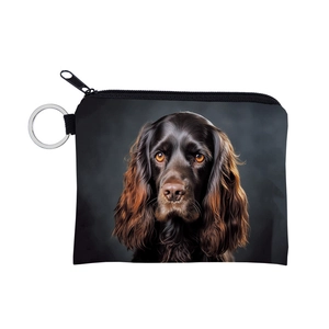 Close-up of the zipper closure and detailed dog print on a portable canvas coin purse