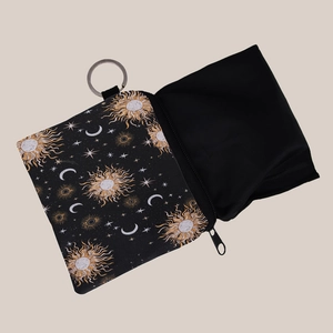 Portable coin purse with star and moon prints featuring a metal keychain and foldable bag