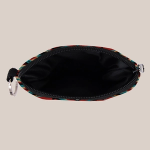 Detailed internal view of the ethnic Aztec print coin purse with a black fabric lining