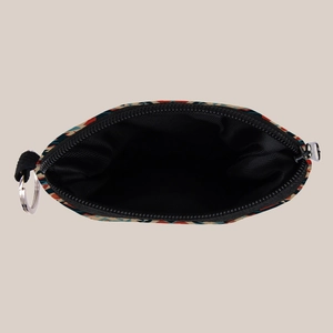 Detail view of ethnic Aztec print coin purse with silver keychain and black zipper closure