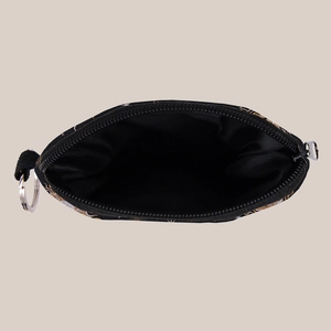 Detail view of the star and moon pattern coin pouch with silver zipper and interior lining