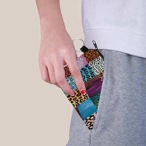 Portable leopard print coin purse with colorful patchwork and metal keychain ring