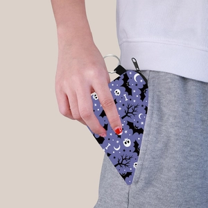 Purple Halloween triangle coin purse with bat skull prints and a metal keychain ring