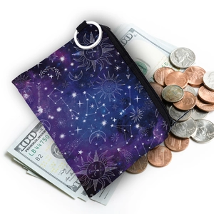 Starry sky and moon pattern coin purse with silver keychain on white background