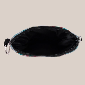 Macro view of mermaid print coin purse with black lining and metal keychain hook
