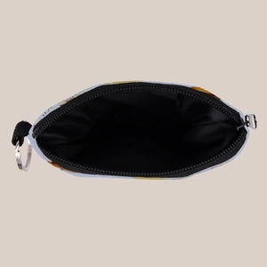 Detail view of colorful mushroom coin purse with black lining and silver keychain
