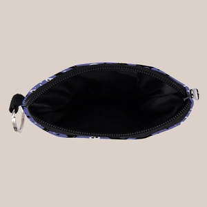 Detail view of purple Halloween coin purse with eye patterns and metal keyring