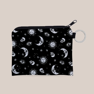 Detail of sun and moon printed coin purse with zipper and silver keyring attachment