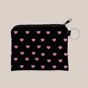 Detail of black heart-patterned coin purse featuring silver keychain and zipper closure