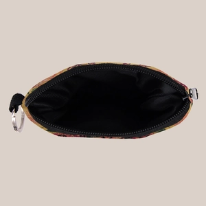 Detail view of sunflower fabric coin purse interior with black lining and metal keychain