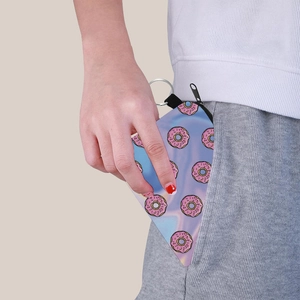 Close-up of a compact donut print coin purse with a zipper and metal keychain hook