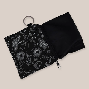 Detail view of gothic moth print coin pouch with silver keychain ring and smooth zipper