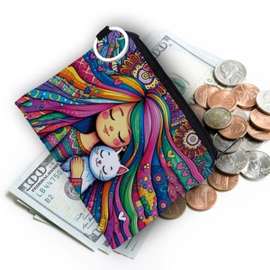 Artistic coin purse with girl and cat print surrounded by cash and coins