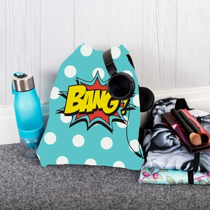 Detail showing light blue drawstring bag with white polka dots and yellow BANG print