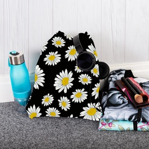 Detail view of sunflower pattern drawstring backpack with daily travel accessories