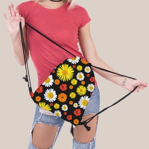 Close-up of lightweight drawstring bag with vibrant sunflower print on a black background