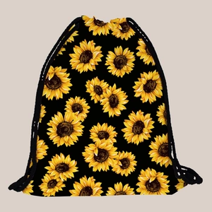 Close-up of vibrant sunflower pattern on lightweight black drawstring travel backpack