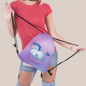 Close-up of drawstring backpack featuring a unicorn print and pink gradient color