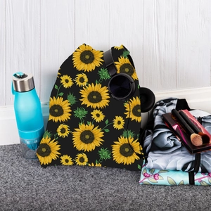 Detail shot of sunflower drawstring bag with fitness gear on grey carpet flooring