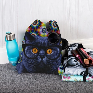 Detailed view of cat print drawstring bag with headphones and water bottle on a mat