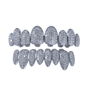 Macro shot of silver hip-hop grillz with iced-out cubic zirconia stones on metal base