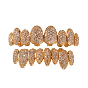 Detail view of 8-tooth hip hop gold grillz set with micro-pave cubic zirconia crystals