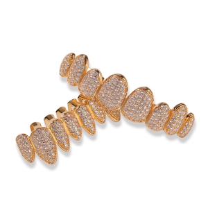 Detailed macro view of hiphop gold grillz with sparkling micro-pave cubic zirconia stones