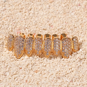 Detail of 8-tooth hip hop grillz with gold plating and micro-paved cubic zirconia stones