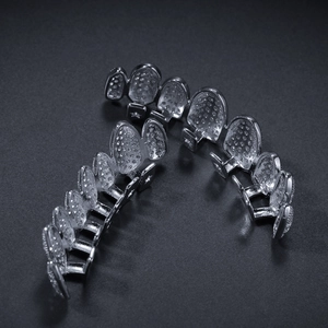 Macro view of silver hip hop dental grills with micro-pave cubic zirconia stones