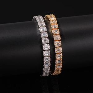 Detail of silver and gold hip hop tennis bracelets with emerald-cut cubic zirconia stones