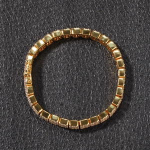 Detailed close-up of golden hip hop tennis bracelet with square-cut zircon stones