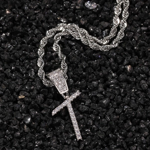Close-up of hip-hop silver plated letter T pendant with zircon crystals on rope chain