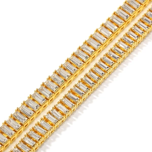 Detailed macro view of gold baguette-cut crystals on hip hop style tennis chain