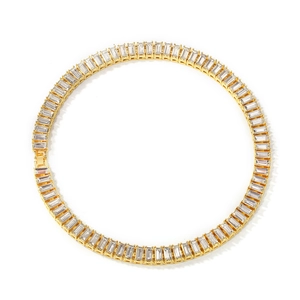 Macro detail of gold-plated tennis necklace featuring baguette-cut zircon stones