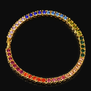 Detailed macro view of 4mm rainbow tennis bracelet with multi-color stones in gold setting
