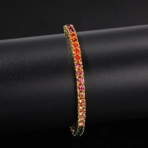 Macro detail of 4mm rainbow tennis bracelet with gradient gemstones on gold base