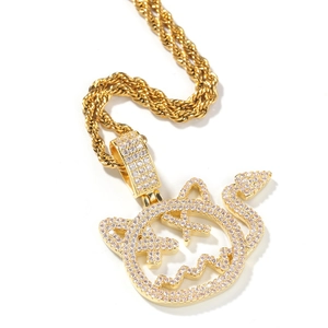 Detail of hip hop devil cat pendant with sparkling zircons and golden rope chain
