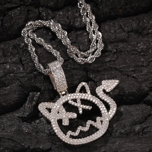 Hip hop style devil face pendant necklace with cubic zirconia on black rock background