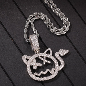 Detailed close-up of a hip hop demon pendant with X-shaped eyes and cubic zirconia inlay