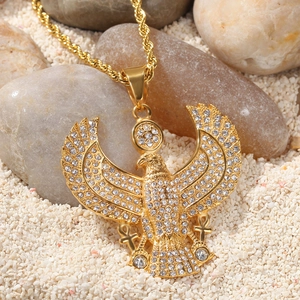 Detail view of hip hop Egyptian eagle pendant with crystals on rope chain