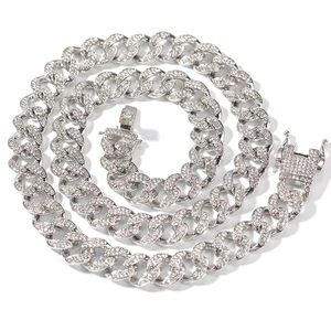 Detailed shot of 13mm iced out Cuban link chain with secure clasp and silver plating