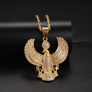 Macro shot of hip hop eagle pendant with diamond accents and ankh cross detail