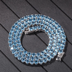 Detail of 4mm tennis chain with blue cubic zirconia stones and secure box clasp
