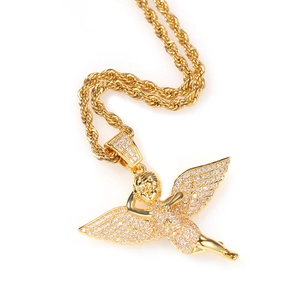 Close-up of hip-hop angel wing pendant necklace with gold plating and paved zircon stones