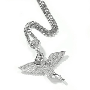 Close-up of hip hop angel wing pendant with micro-pave zircons and cuban chain link