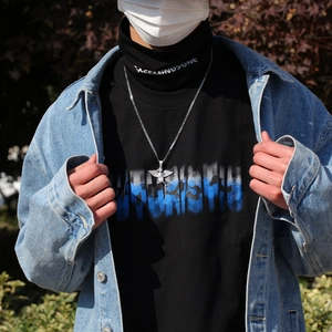 Hip hop angel wing pendant necklace with zircons styled with streetwear denim jacket