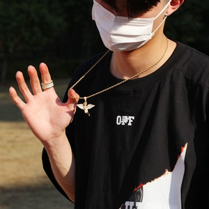 Hip hop gold plated angel wing pendant necklace and paved rhinestone ring set on male model